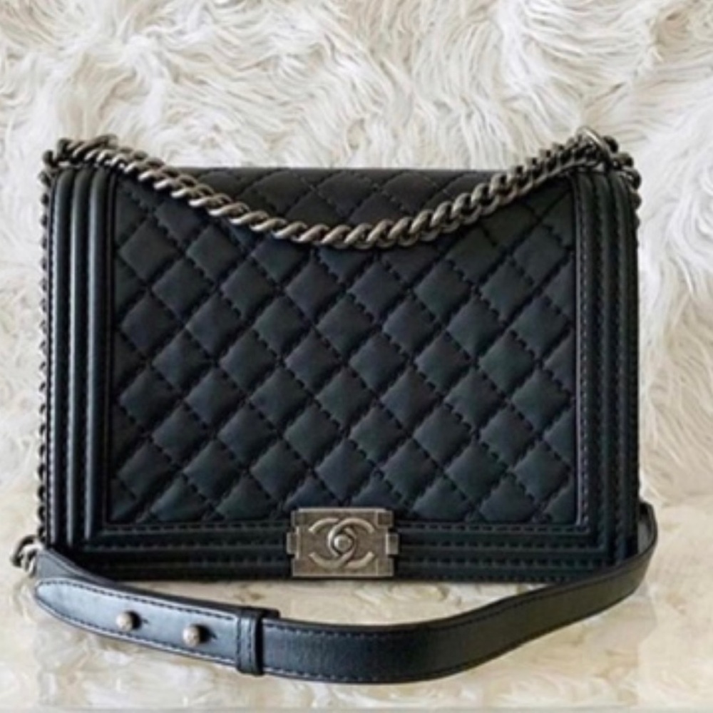 Authentic large Chanel Boy Bag in black calfskin. Comes with full set.